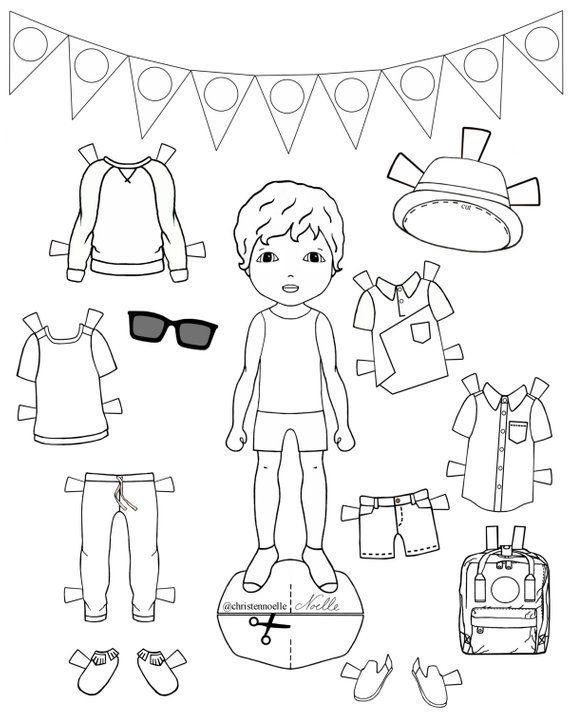 Child cutting out paper doll outfits from printable sheets.