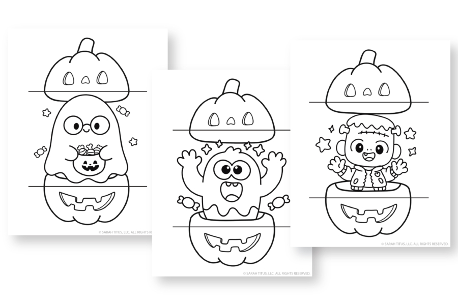 Spread of colorful Halloween card designs laid out on a workspace