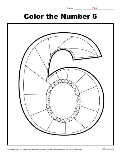Student examining a large number 6 counting card