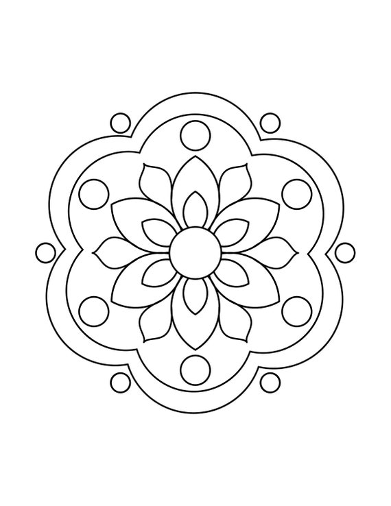 Flat lay of a home desk with mandala coloring supplies