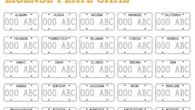 An elementary student tracing letters on a printable license plate worksheet