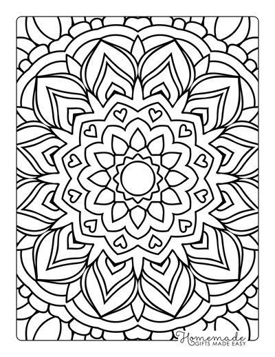 Close-up of a child coloring a mandala page